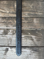 Black leather with deep caiman print scaling and a clean tapered tip — bold exotic texture with a sleek, all-black finish. A statement belt that pairs with virtually anything in your western wardrobe.