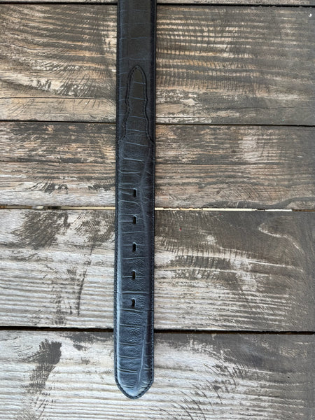 Black leather with deep caiman print scaling and a clean tapered tip — bold exotic texture with a sleek, all-black finish. A statement belt that pairs with virtually anything in your western wardrobe.