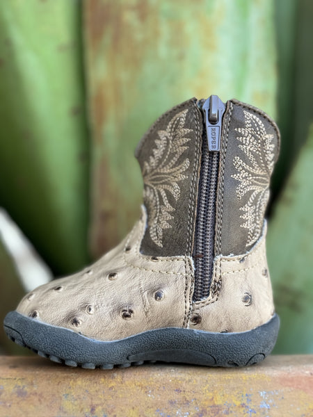 Introduce your baby to upscale Western wear with this charming Infant Baby Roper Boot! Made from leather with a stylish tan ostrich texture, this boot offers a luxurious look for tiny feet. Designed for ease and comfort, it features a handy side zipper for quick changes. The durable rubber sole provides excellent traction and flexibility for little explorers on the move.  Infant Roper Boot - 91612243500 - Available at BLAIR'S Western Wear located in Marble Falls TX 