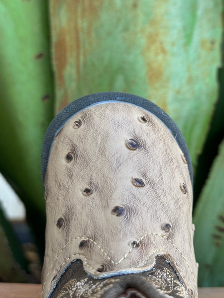 Introduce your baby to upscale Western wear with this charming Infant Baby Roper Boot! Made from leather with a stylish tan ostrich texture, this boot offers a luxurious look for tiny feet. Designed for ease and comfort, it features a handy side zipper for quick changes. The durable rubber sole provides excellent traction and flexibility for little explorers on the move.  Infant Roper Boot - 91612243500 - Available at BLAIR'S Western Wear located in Marble Falls TX 