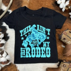 Infant Cinch Short Sleeve T-Shirt  in the colors black with turquoise with "THIS AIN'T MY FIRST RODEO" and a cowboy riding a wild horse graphic - MTT7672060 - Available at Blair's Western Wear located in Marble Falls TX