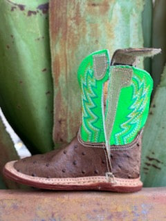 Infant Baby Roper Boot crafted from genuine leather in a classic brown hue with playful lime green accents. They feature a Velcro side closure for easy on and off. The sturdy rubber sole provides the grip and flexibility needed for those first steps.  Infant Roper Boots - 91679128247 - BLAIR'S Western Wear located in Marble Falls TX