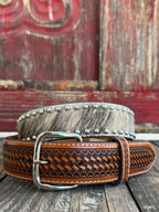 This belt features rich brown full-grain leather with a beautifully detailed basketweave tooling pattern, contrasting white stitching, and a polished silver buckle. The genuine hair-on hide leather accent adds natural texture and character, making each belt one of a kind with its own unique color variations and markings.
Available at Blair's Western Wear located in Marble Falls TX 