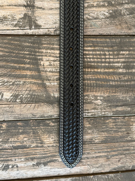 A close-up of a black woven leather belt, featuring white contrast stitching , laid flat on a rustic wooden plank background. Available at Blair's Western Wear, Marble Falls, TX