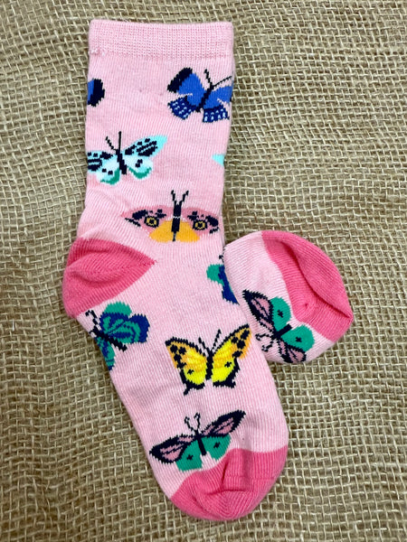 Kids' Socksmith Butterfly Migration crew socks in pink, made with a soft cotton blend for comfort, reinforced heel and toe for durability, and playful multicolor butterfly design - KC1064. Available at Blair's Western Wear, Marble Falls, TX.