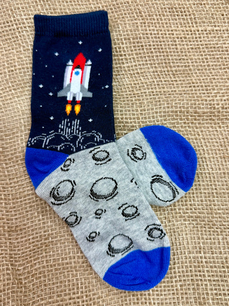 Kids Socksmith novelty socks To The Moon and Back in navy, featuring rocket ship design, with reinforced heel and toe for durability - KC71474. Available at Blair's Western Wear, Marble Falls, TX.
