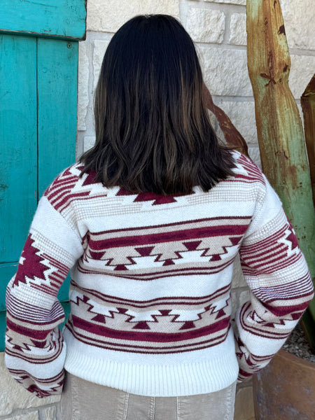 This Ariat Aztec Sweater blends cozy warmth with bold southwestern style. Featuring a soft knit fabric, rich wine-and-tan Aztec pattern, and classic crew neckline, it’s the perfect throw-on piece for cool days and effortless western flair. Available at BLAIR'S Western Wear located in Marble Falls TX. 