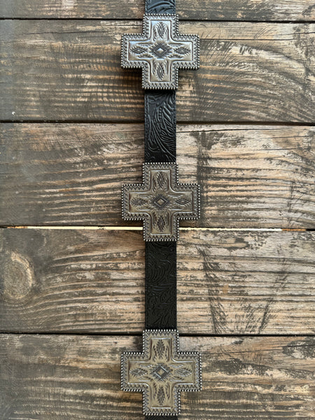Black genuine leather belt with deep floral tooling and oversized cross-shaped silver conchos featuring Aztec-inspired engraving, a beaded rope border, and a diamond center stone. A bold western statement piece for any occasion.

Available at Blair's Western Wear, Marble Falls, TX