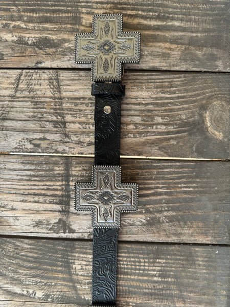 Black genuine leather belt with deep floral tooling and oversized cross-shaped silver conchos featuring Aztec-inspired engraving, a beaded rope border, and a diamond center stone. A bold western statement piece for any occasion.

Available at Blair's Western Wear, Marble Falls, TX