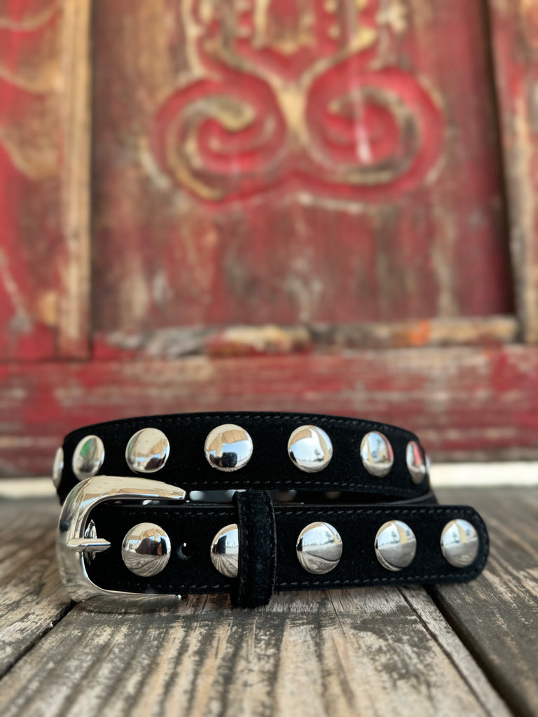 A sleek black leather skinny belt lined with a single row of polished dome silver studs — effortlessly edgy, endlessly versatile. The silver buckle ties it all together for a look that moves from casual to country-chic without missing a beat.