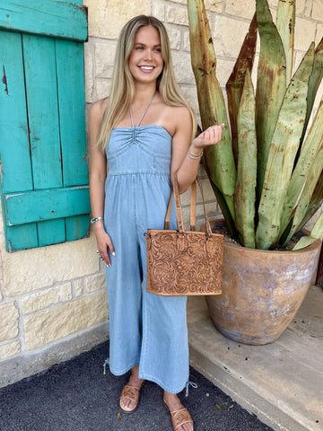 Ladies Denim Jumpsuit in light wash blue, lightweight fabric for breathable comfort with smocked back and adjustable tie hem - BK11960. Available at Blair's Western Wear, Marble Falls, TX.