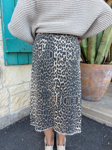 This Easel Denim Leopard Skirt features a light-wash finish, a flattering high-waisted silhouette, and a stylish front slit for easy movement. With a raw-edge hem, classic pockets, and soft stretch denim, it’s the perfect blend of comfort and casual, on-trend style. Available at BLAIR'S Western Wear located in Marble Falls TX.
