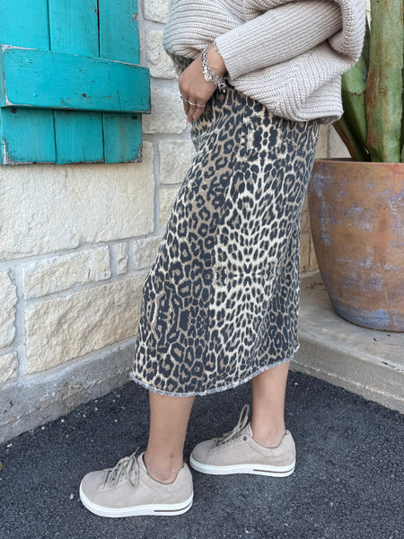 This Easel Denim Leopard Skirt features a light-wash finish, a flattering high-waisted silhouette, and a stylish front slit for easy movement. With a raw-edge hem, classic pockets, and soft stretch denim, it’s the perfect blend of comfort and casual, on-trend style. Available at BLAIR'S Western Wear located in Marble Falls TX.
