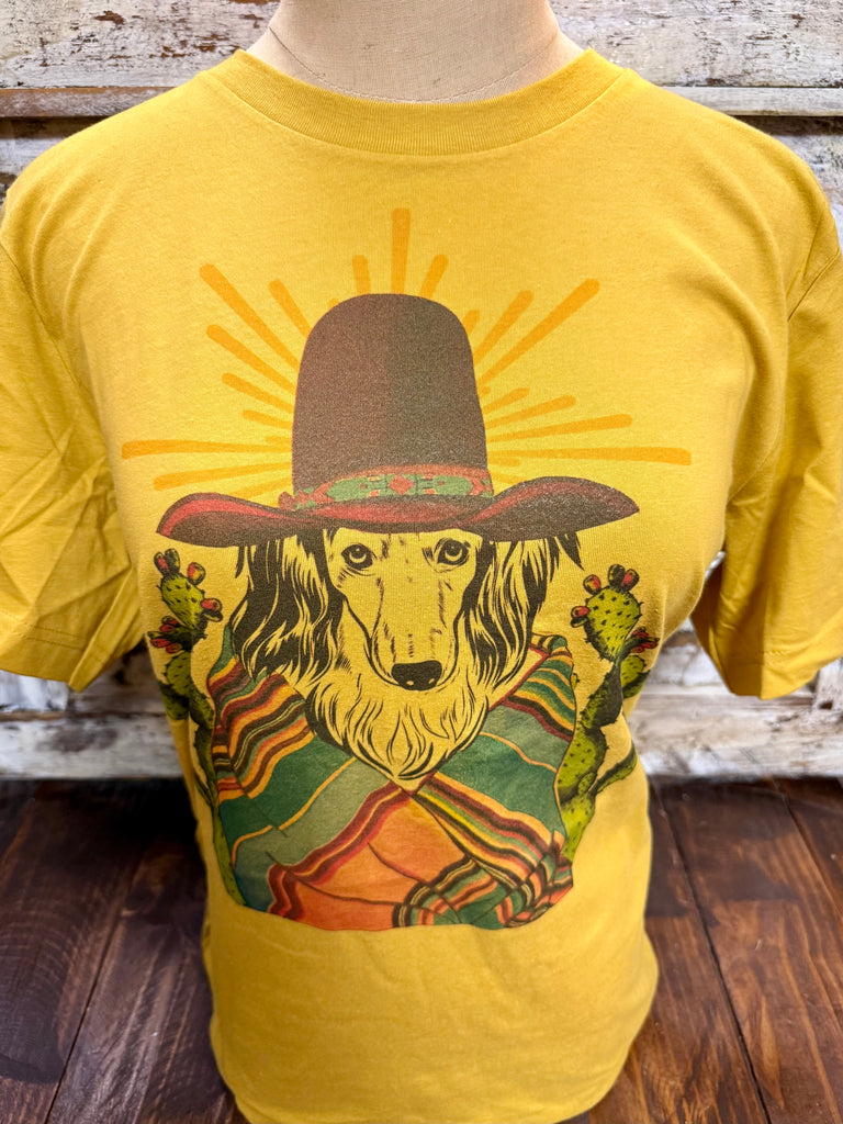 Ladies Emily Laurence short sleeve graphic tee featuring a serape sheep dog collie in mustard and multi colors, soft cotton fabric for everyday comfort, with a bold western-inspired graphic design – COLLIE. Available at Blair's Western Wear, Marble Falls, TX.