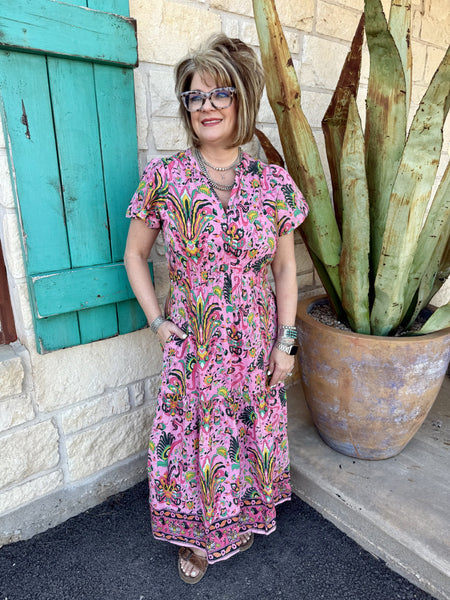 Ladies Ivy Jane Dress in pink, green, and yellow, featuring a flattering V-neckline, tiered maxi skirt, and breathable cotton fabric – 75709. Available at Blair's Western Wear, Marble Falls, TX.