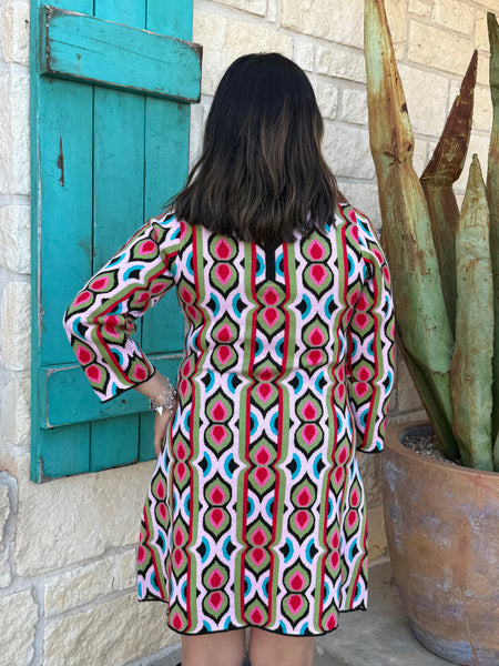 The Ivy Jane Multicolored Retro Knit Dress brings bold, vintage-inspired style to your everyday wardrobe. Its soft, sweater-knit fabric, mock-turtleneck, and 3/4 sleeves create a cozy yet polished look, while the structured silhouette flatters effortlessly. Finished with a convenient back half-zip, this eye-catching dress blends comfort and retro charm in one easy piece. Available at BLAIR'S Western Wear located in Marble Falls TX. 