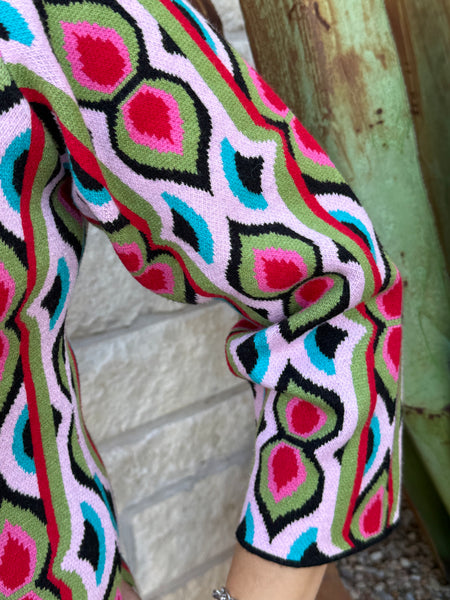 The Ivy Jane Multicolored Retro Knit Dress brings bold, vintage-inspired style to your everyday wardrobe. Its soft, sweater-knit fabric, mock-turtleneck, and 3/4 sleeves create a cozy yet polished look, while the structured silhouette flatters effortlessly. Finished with a convenient back half-zip, this eye-catching dress blends comfort and retro charm in one easy piece. Available at BLAIR'S Western Wear located in Marble Falls TX. 
