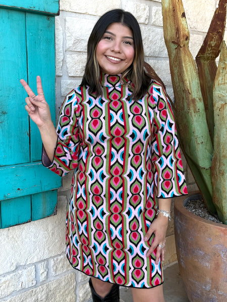 The Ivy Jane Multicolored Retro Knit Dress brings bold, vintage-inspired style to your everyday wardrobe. Its soft, sweater-knit fabric, mock-turtleneck, and 3/4 sleeves create a cozy yet polished look, while the structured silhouette flatters effortlessly. Finished with a convenient back half-zip, this eye-catching dress blends comfort and retro charm in one easy piece. Available at BLAIR'S Western Wear located in Marble Falls TX. 