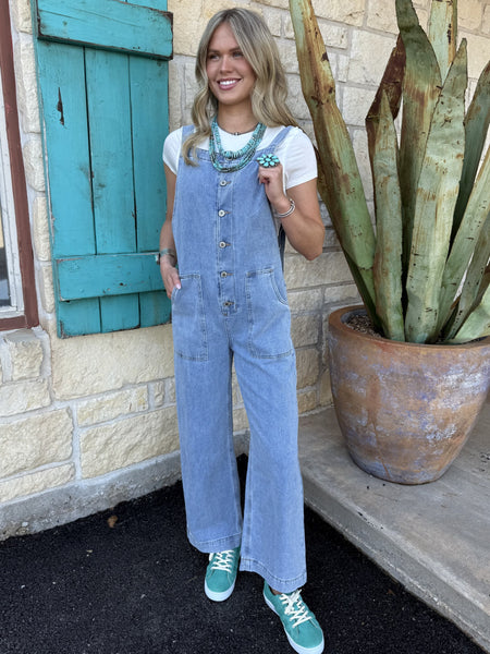 Ladies light wash denim jumpsuit in 100% cotton, featuring wide-leg cut with button-down front and patch pockets - WL249060. Available at Blair's Western Wear, Marble Falls, TX.
