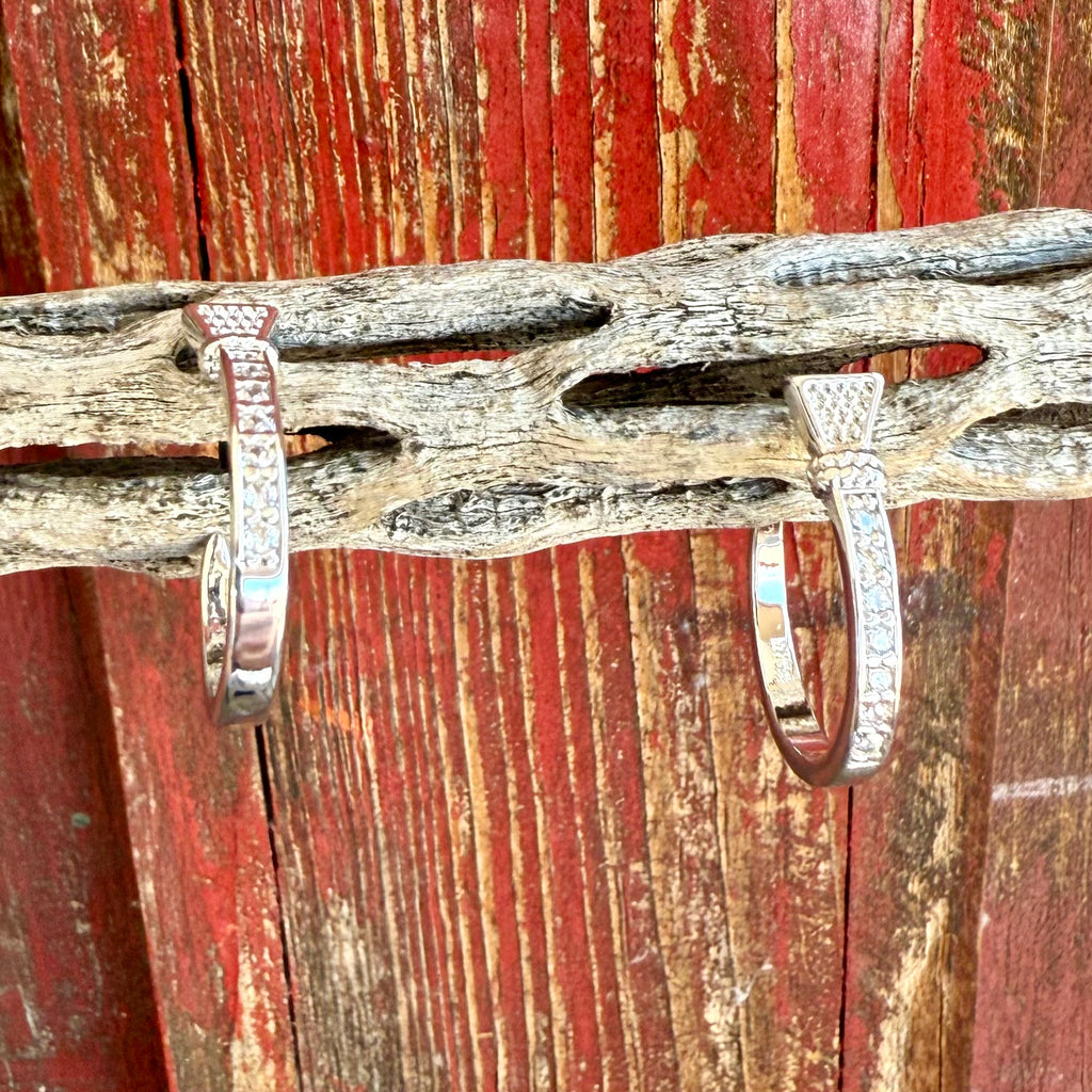 Ladies Montana Silversmiths silver horseshoe nail hoop earrings with cubic zirconia accents and a secure hinge clasp - ER6325. Available at Blair's Western Wear, Marble Falls, TX.