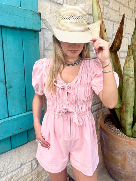 Ladies Pink Romper in washed cotton, smocked bodice for stretch with puff sleeves and elastic drawstring waist - IR39870-02. Available at Blair's Western Wear, Marble Falls, TX.