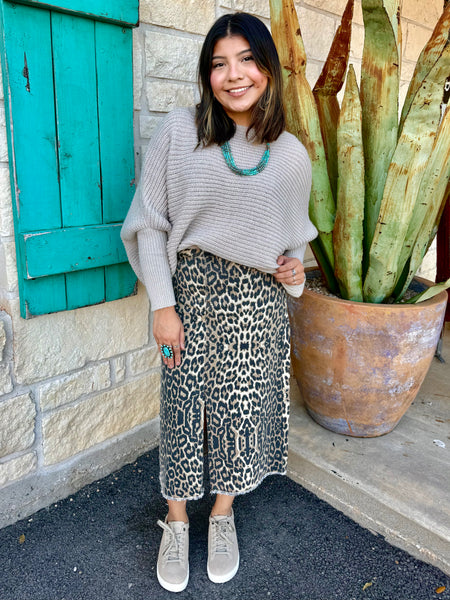 This sweater in Natural is the perfect blend of comfort and effortless style. Made with a soft, textured knit, it features a relaxed drop-shoulder fit paired with long, ribbed sleeves for a cozy yet polished look. Its neutral shade makes it easy to pair with anything—from denim to printed skirts—while the lightweight feel keeps it comfortable for all-day wear. Simple, timeless, and effortlessly chic. Available at BLAIR'S Western Wear located in Marble Falls TX.