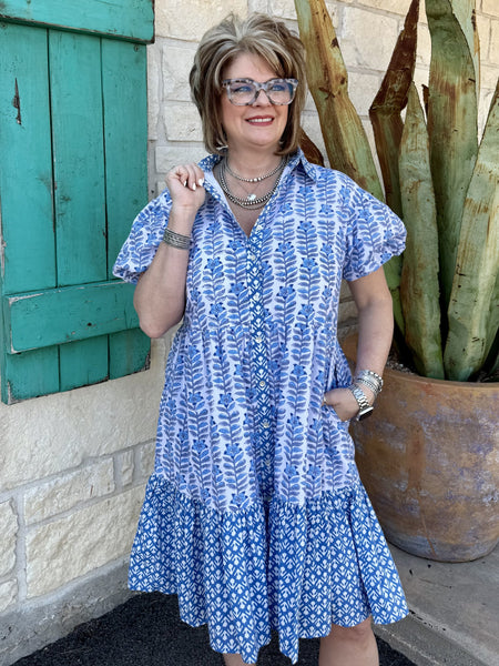 Ladies Ivy Jane Dress in blue, light blue, and white, featuring short puff sleeves, collared neckline, and tiered silhouette with side pockets and front buttons - 75664. Available at Blair's Western Wear, Marble Falls, TX.