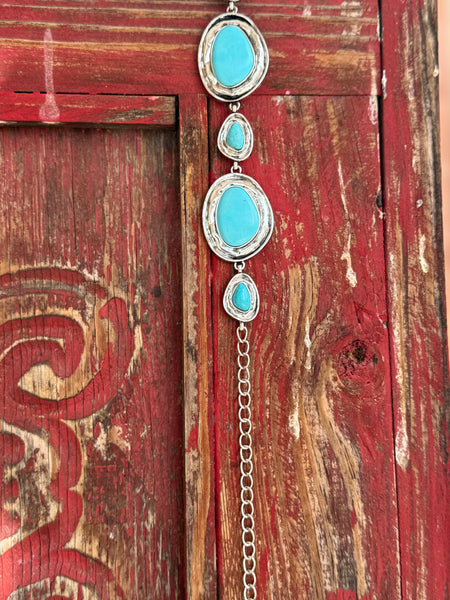 Alternating large oval and small teardrop turquoise-stone cabochons set in hammered silver frames, linked together by a delicate silver chain — this belt is pure Southwestern soul. Bold enough to be the centerpiece of any outfit, yet refined enough to wear anywhere the occasion calls for a little western elegance. Available at Blair's Western Wear 