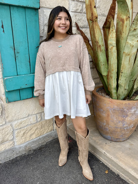 Ladies two‑tone overlay dress in taupe & ivory, featuring a knit crop sweater overlay and floaty under‑dress skirt with heart patch detail and long sleeves – DK11396. Available at Blair's Western Wear, Marble Falls, TX.