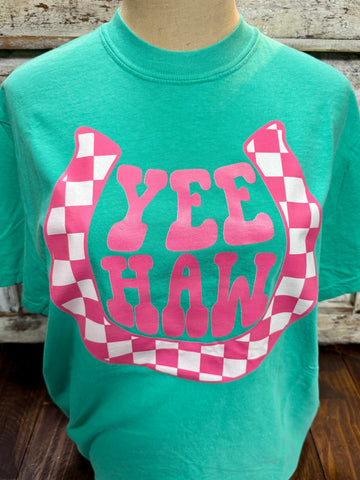 Ladies Yee Haw CK graphic tee in teal, bold pink YEE HAW horseshoe graphic, soft breathable fabric with classic short-sleeve fit - YEE HAW CK. Available at Blair's Western Wear, Marble Falls, TX.