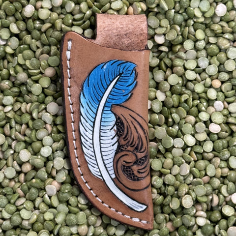 Leather Sheath in brown with blue-and-white feather tooling, hand-tooled leather design with curved fit - 29RST04A. Available at Blair's Western Wear, Marble Falls, TX.