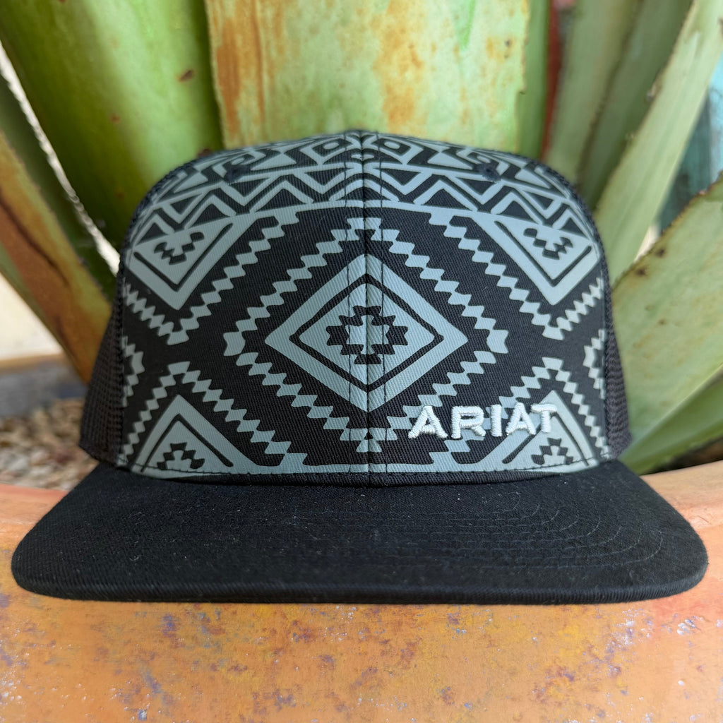 A black and gray aztec patterned trucker hat with a gray embroidered 'ARIAT' logo on the front,