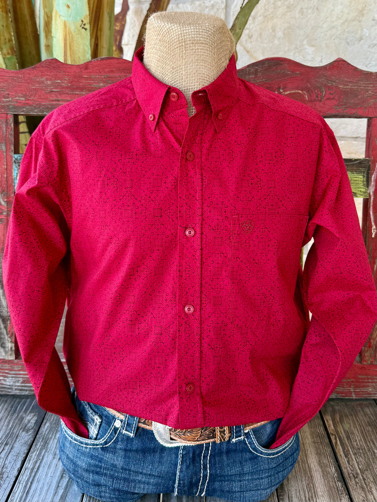 Men’s Ariat button-down print shirt in red with black geometric pattern, breathable cotton comfort, and adjustable cuffs – 10065853. Available at Blair’s Western Wear, Marble Falls, TX.