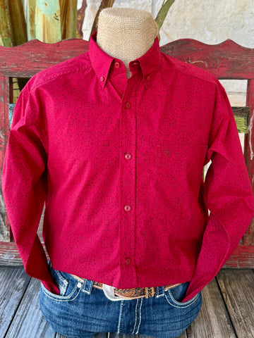Men’s Ariat button-down print shirt in red with black geometric pattern, breathable cotton comfort, and adjustable cuffs – 10065853. Available at Blair’s Western Wear, Marble Falls, TX.