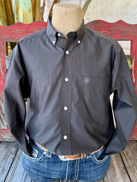 Men’s Ariat button-down solid charcoal shirt, made from wrinkle-resistant pinpoint oxford fabric, with Greater Arm Mobility™ for easy movement – 10065843. Available at Blair’s Western Wear, Marble Falls, TX.