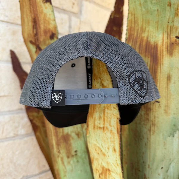 A gray mesh trucker-style cap shown from the back, featuring a gray adjustable strap and a black logo patch on the side,