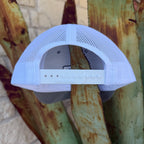 A white Richardson trucker-style cap with a mesh back and adjustable snap strap