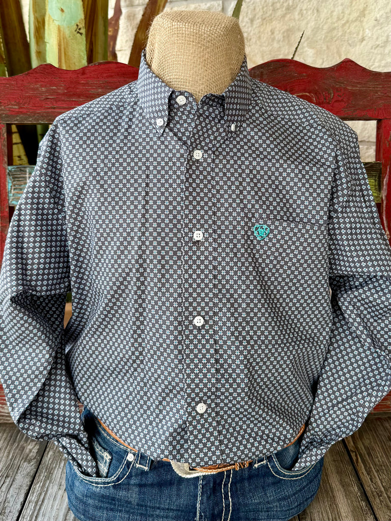 Men’s Ariat long sleeve button-down print shirt in dark grey, crafted from breathable cotton, with a teal and white geometric pattern and embroidered logo chest pocket - 10062228. Available at Blair's Western Wear, Marble Falls, TX.