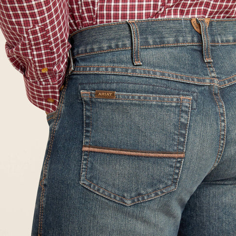 Men's Ariat Boot Cut Jean in Medium Wash, enhanced durability, relaxed fit, boot-cut design, and reinforced construction - 10047531. Available at Blair's Western Wear, Marble Falls, TX.