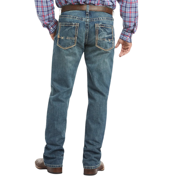 Men's relaxed fit bootcut jean in medium wash 13 oz. ring-spun cotton denim with hand-sanding and whisker details — Blair's Western Wear Marble Falls TX


