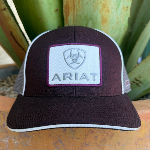 A dark burgundy and white ARIAT trucker hat with a white front patch featuring the brand logo