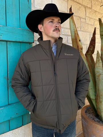 Men’s Ariat quilted jacket in olive, featuring water-resistant ripstop fabric, lightweight insulation, and an interior concealed carry pocket – 10062547. Available at Blair’s Western Wear, Marble Falls, TX.