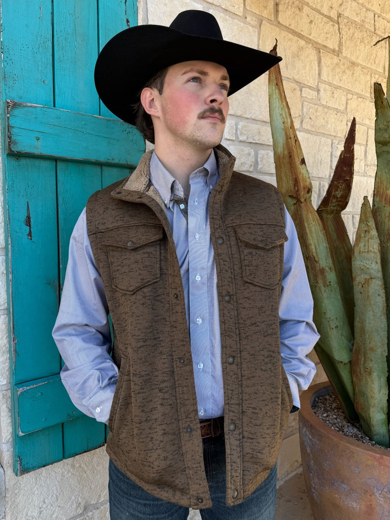 Men’s Ariat Sherpa Vest in Cub Brown, featuring a sherpa-lined interior for warmth, with snap-front closure and dual flap chest pockets – 10062485. Available at Blair’s Western Wear, Marble Falls, TX.
