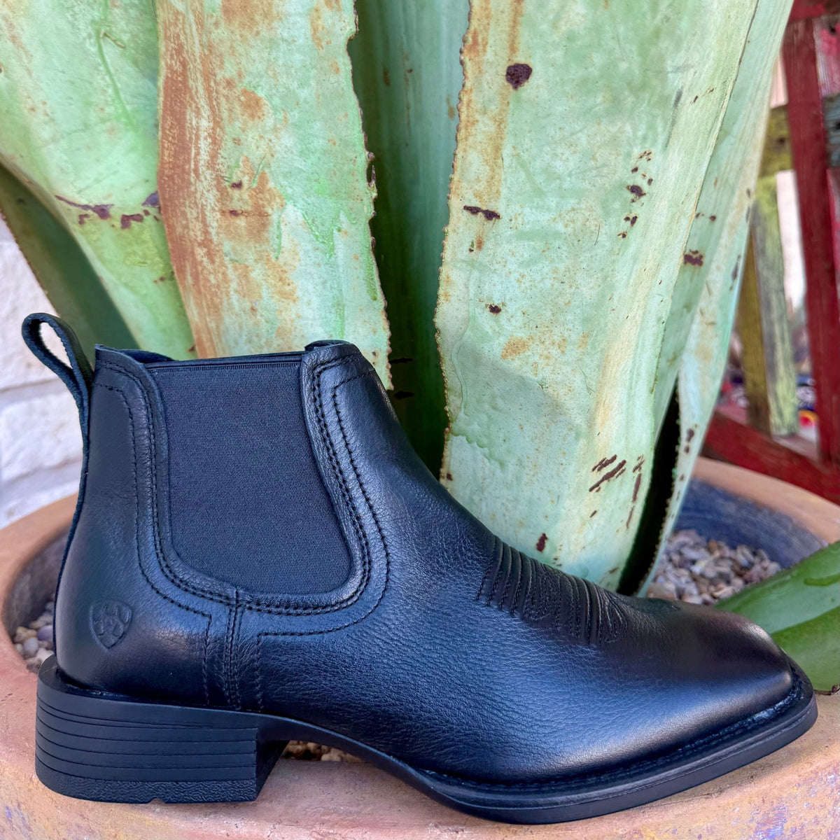 Men’s Ariat slip-on leather boot in black, featuring elastic side gores for easy entry, with a lightweight outsole that adds stability – 10031453. Available at Blair's Western Wear, Marble Falls, TX.