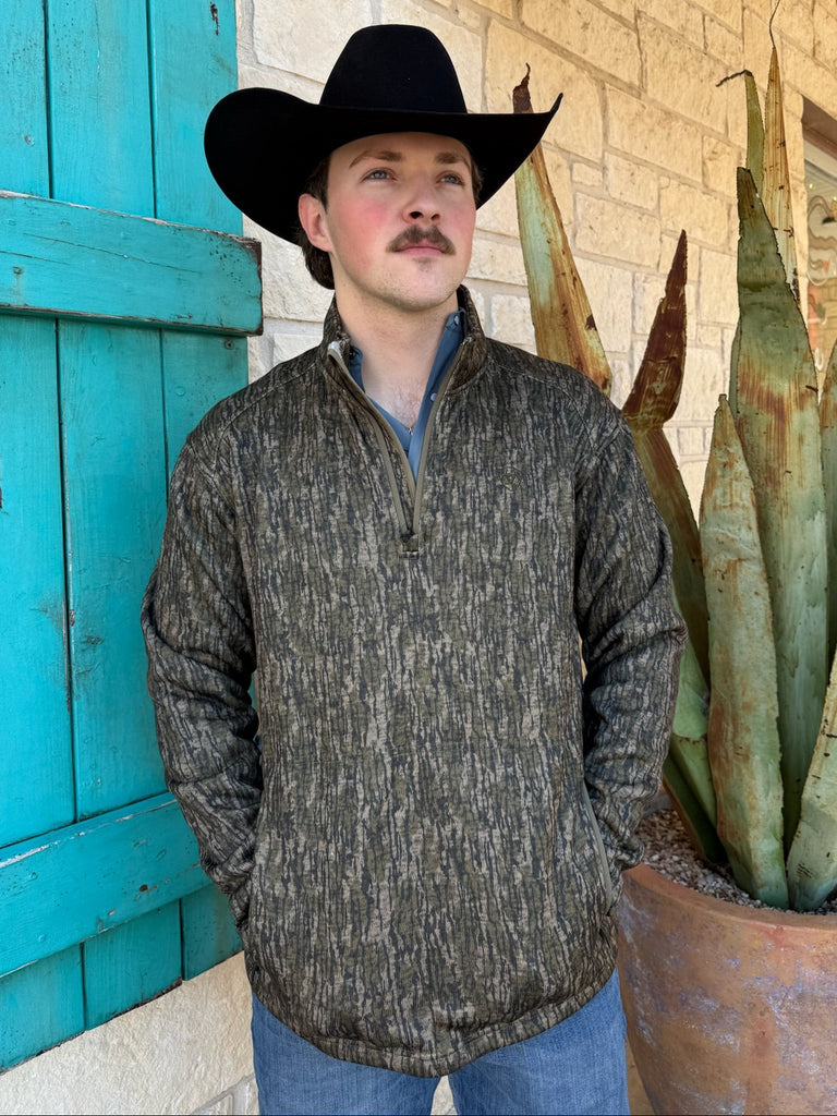 Men’s Ariat fleece 1/4 zip pullover in olive/tan camo, with zippered hand pockets and breathable fleece comfort – 10062622. Available at Blair’s Western Wear, Marble Falls, TX.