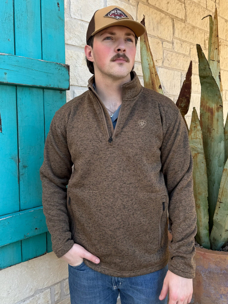 Men’s Ariat ¼-zip sweater in heather brown, made from soft sweater-fleece for warmth, with zippered hand pockets for secure storage – 10073712. Available at Blair’s Western Wear, Marble Falls, TX.