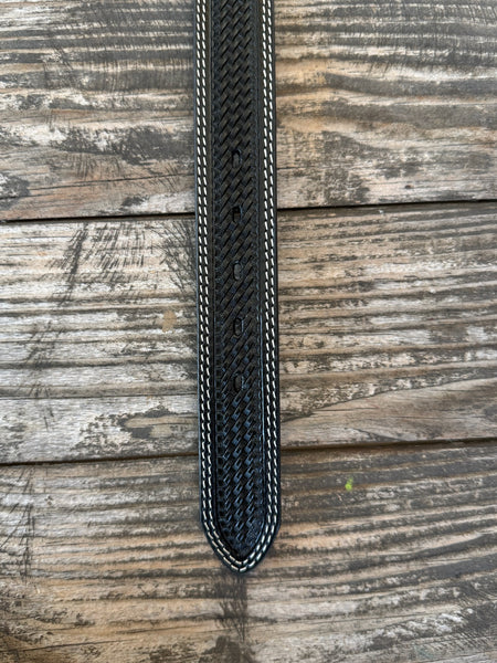 Black leather with full basketweave tooling, scalloped edge detail, and white contrast stitching — finished with a large engraved silver western buckle. A clean, classic western belt with sharp contrast and serious handcrafted character.