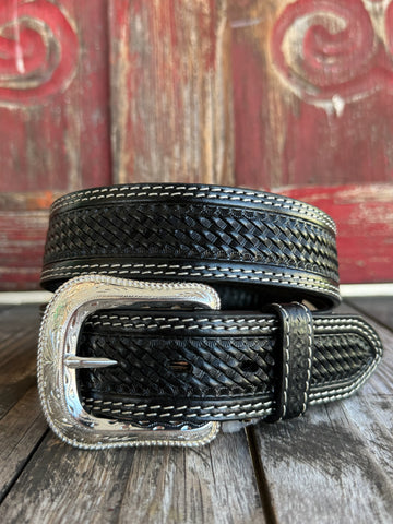 Black leather with full basketweave tooling, scalloped edge detail, and white contrast stitching — finished with a large engraved silver western buckle. A clean, classic western belt with sharp contrast and serious handcrafted character.