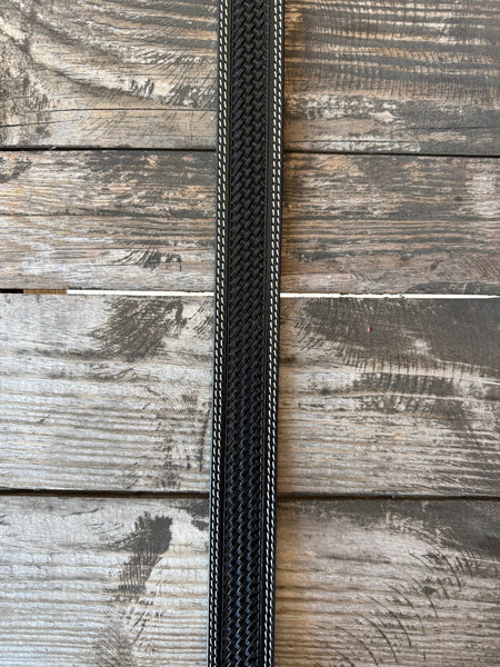 Black leather with full basketweave tooling, scalloped edge detail, and white contrast stitching — finished with a large engraved silver western buckle. A clean, classic western belt with sharp contrast and serious handcrafted character.