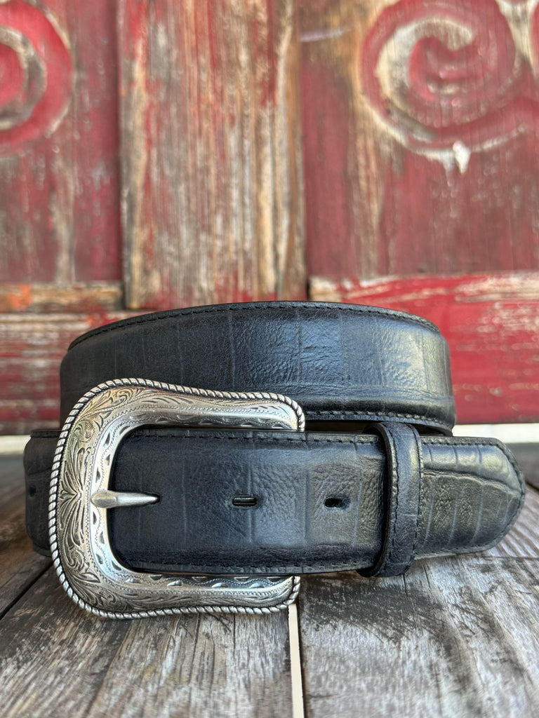 Black leather with deep caiman print scaling and a clean tapered tip — bold exotic texture with a sleek, all-black finish. A statement belt that pairs with virtually anything in your western wardrobe.